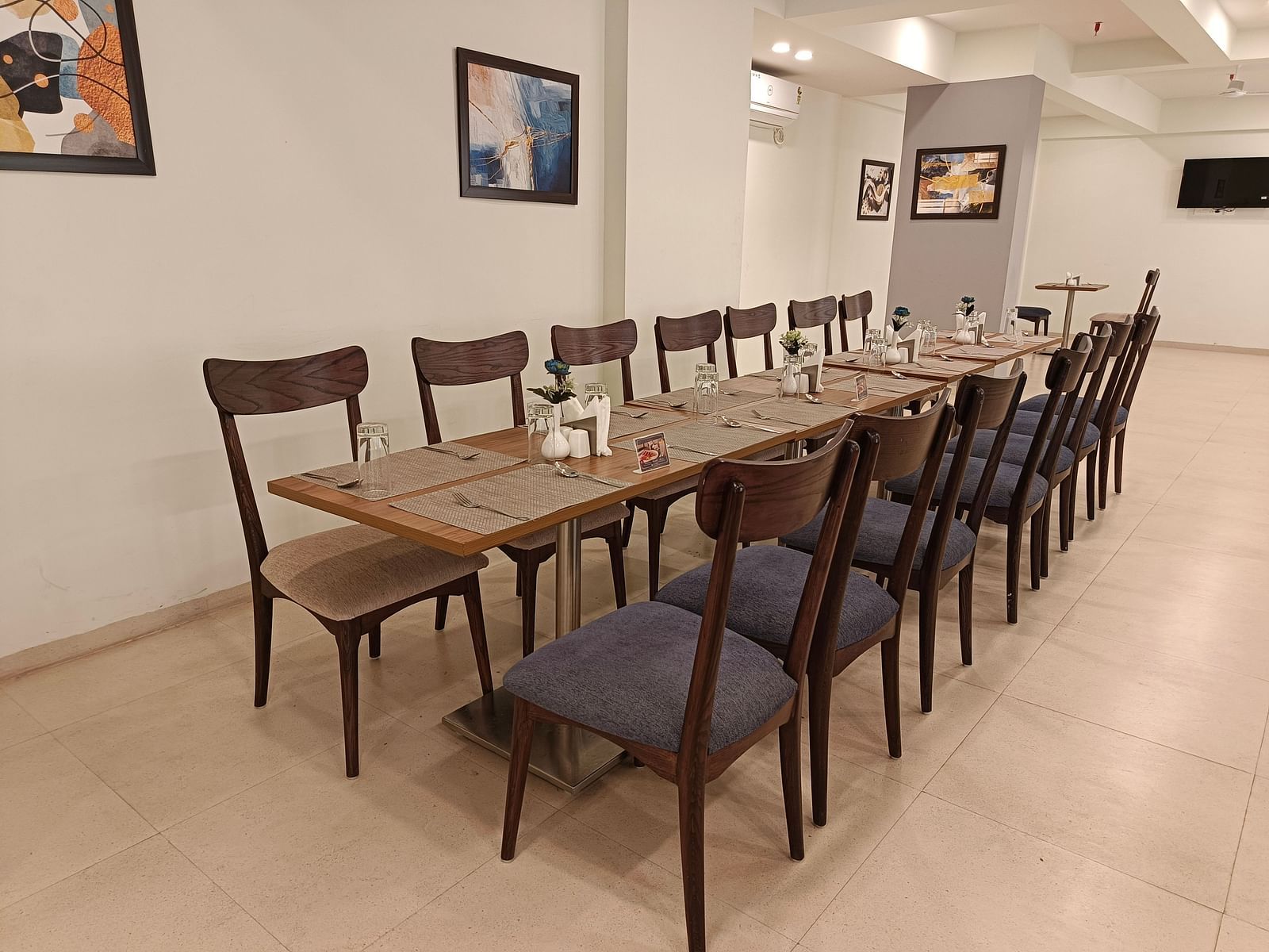 Seating arrangement inside the restaurant 1 - Starlit Suites, Shirdi