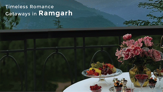 A banner of a table ready with fruits, beverages and flowers with a picturesque silhouette of mountains in the background and the text says 