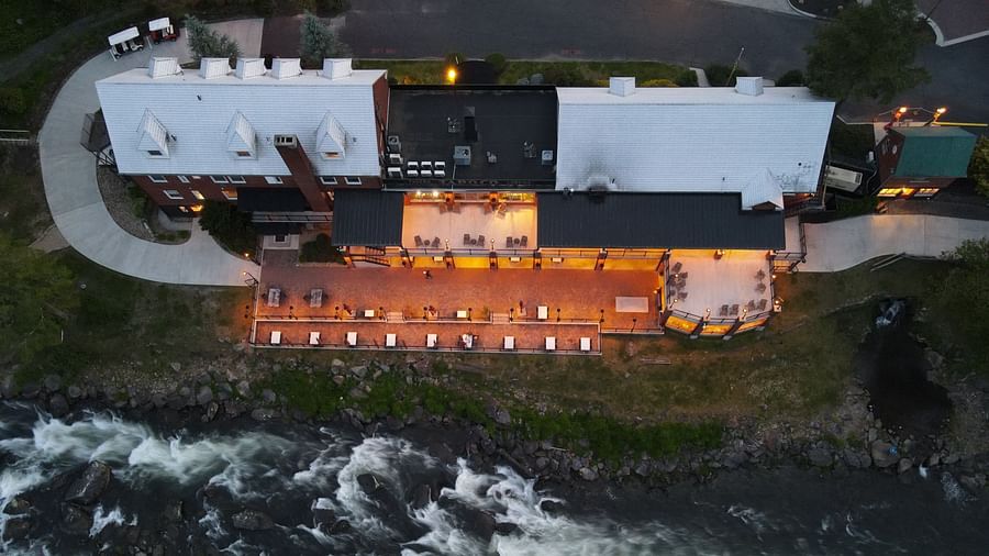 top angle of our resort in Robbinsville during late evening with a river flowing in front of it - Historic Tapoco Lodge