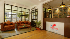 Image of a lobby featuring the seating area and large windows - Magnus Calypso Suites, Viman Nagar