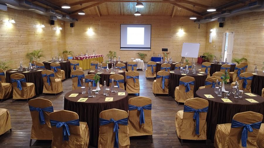 A back view of the banquet hall, projection of the sildes at Full wide front view of the banquet hall- Entry gate of the garden - Lotus Eco Beach Resort Konark
