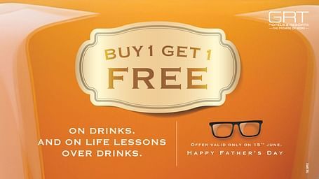  Father’s Day drinks offer by GRT Hotels with “Buy 1 Get 1 Free” text on an orange background featuring glasses and celebration message.