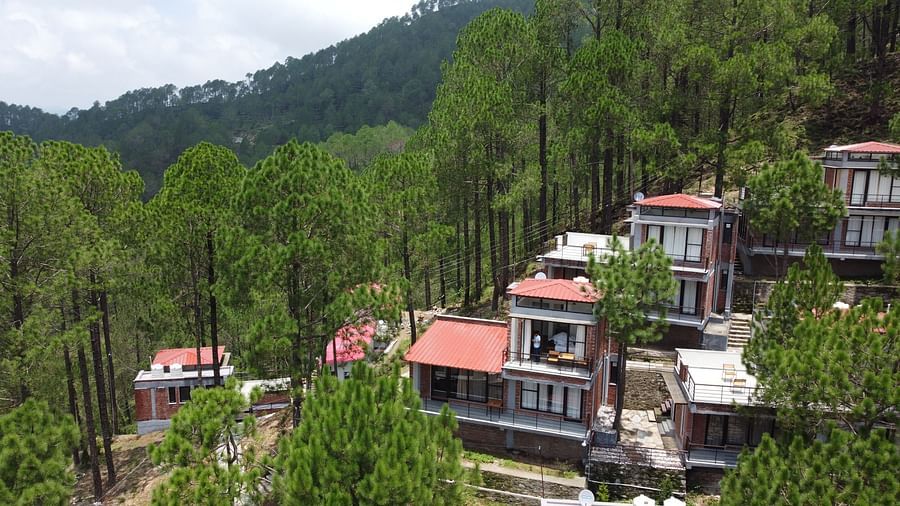 Facade of BluSalzz Escapade Resort, Lansdowne, showcasing its modern architecture and scenic surroundings.