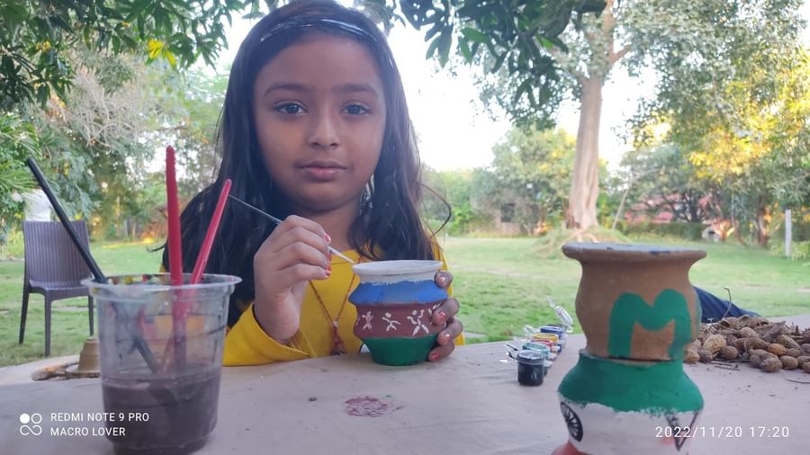 A kid painting and participating in Art & Craft session at Daksh Resort & Amusement Park.