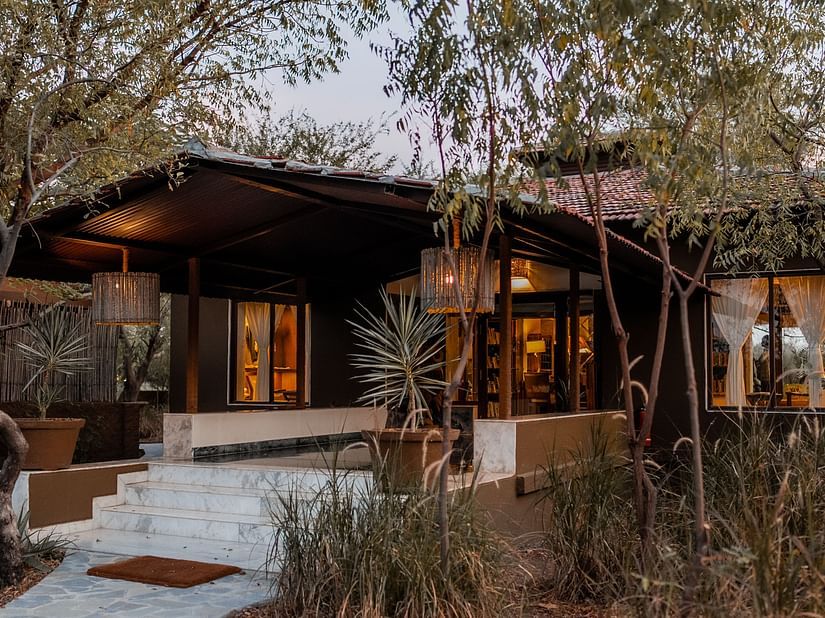The Blackbuck Lodge - entrance of reception area with green trees around