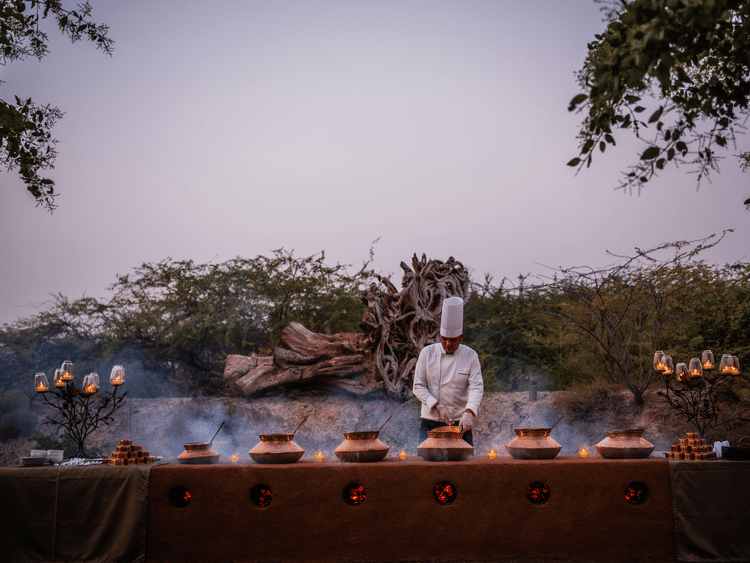 A chef by an outdoor buffer setup at The Blackbuck Lodge 6th slide1 .jpg