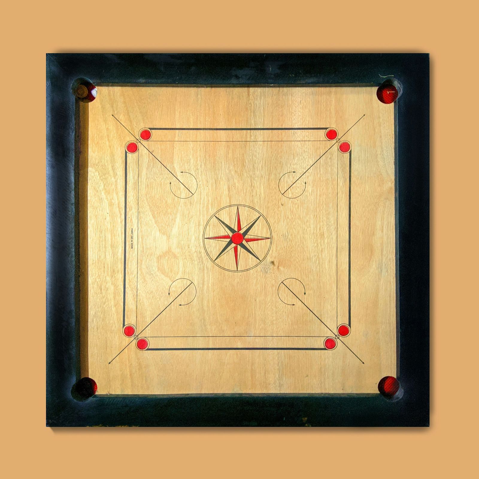 Image of a carrom board kept on a table.