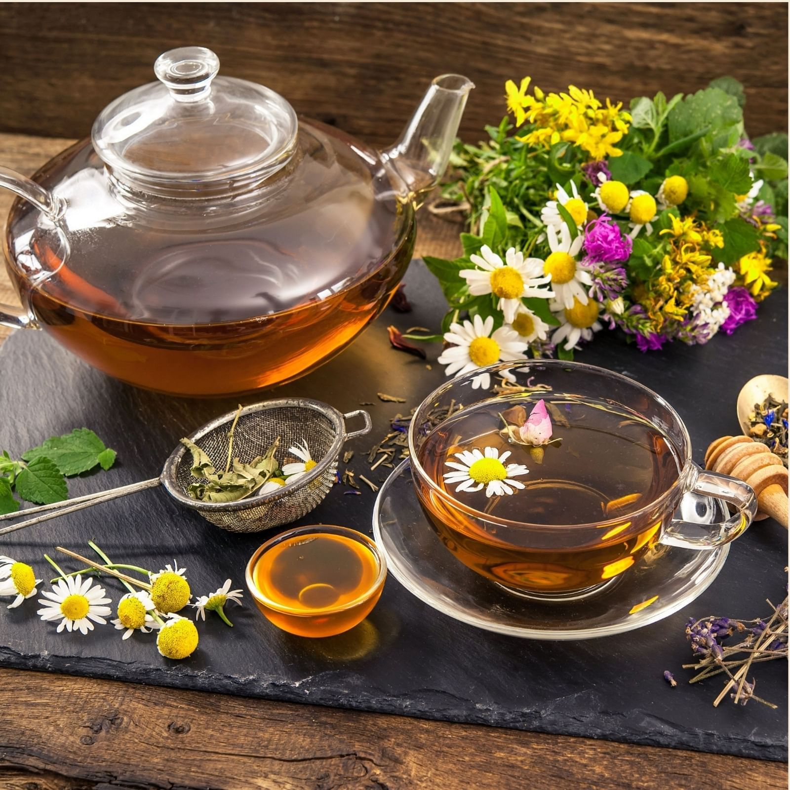 an image of a herbal Tea served in a glass cup and teapot - Rhythm Lonavala