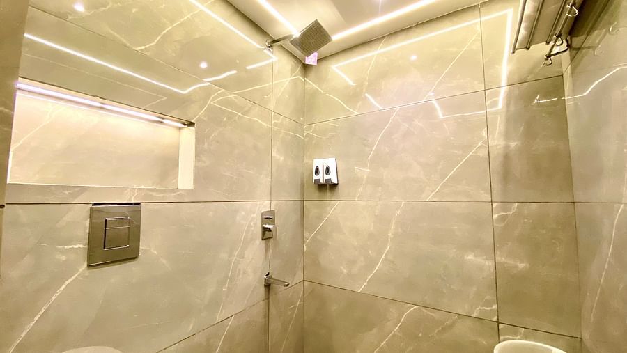 Interior view of a bathroom with a shower space at DLS Park Grace, Haridwar.