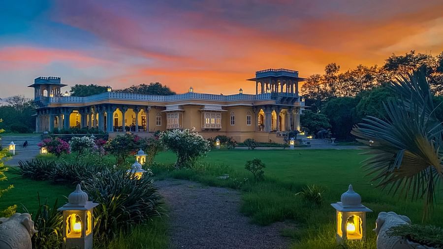 Facade image of Dev Shree, deogarh featuring a beutiful sunset in the background