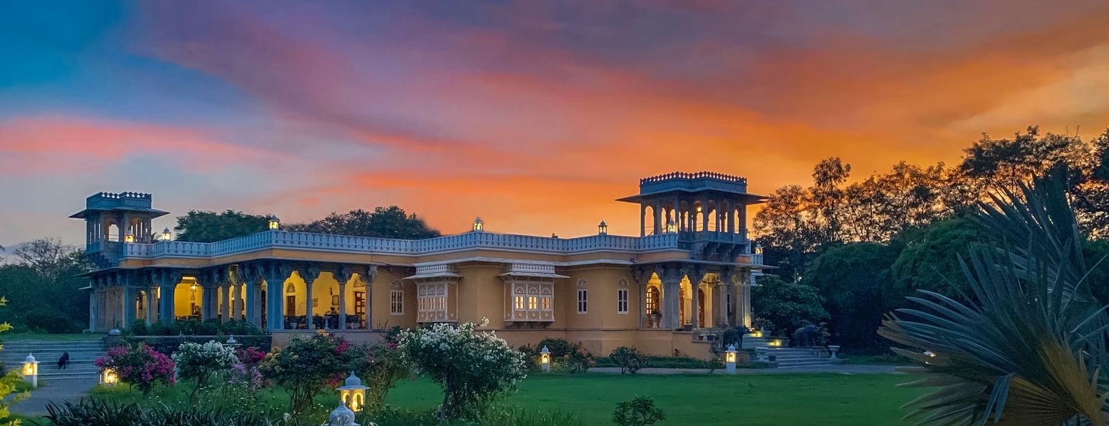 Facade image of Dev Shree, deogarh featuring a beutiful sunset in the background