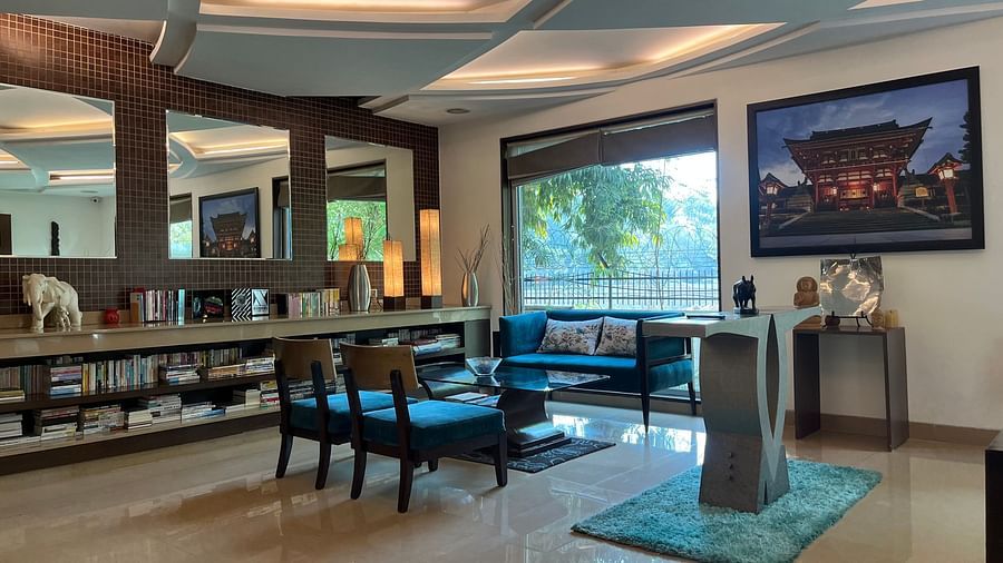 reception and lobby area designed with traditional japanese style consisting of wall paintings and figurines along with large ceiling to floor windows for an aesthetic look2