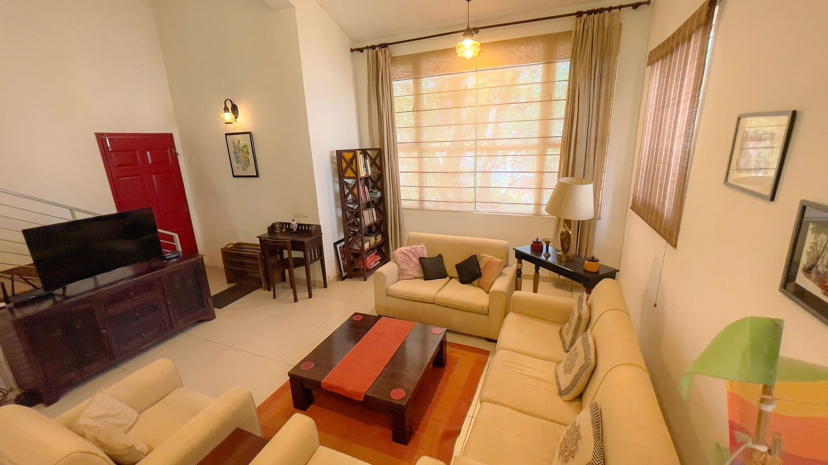sofas and tv inside the living room at El Benito Goa