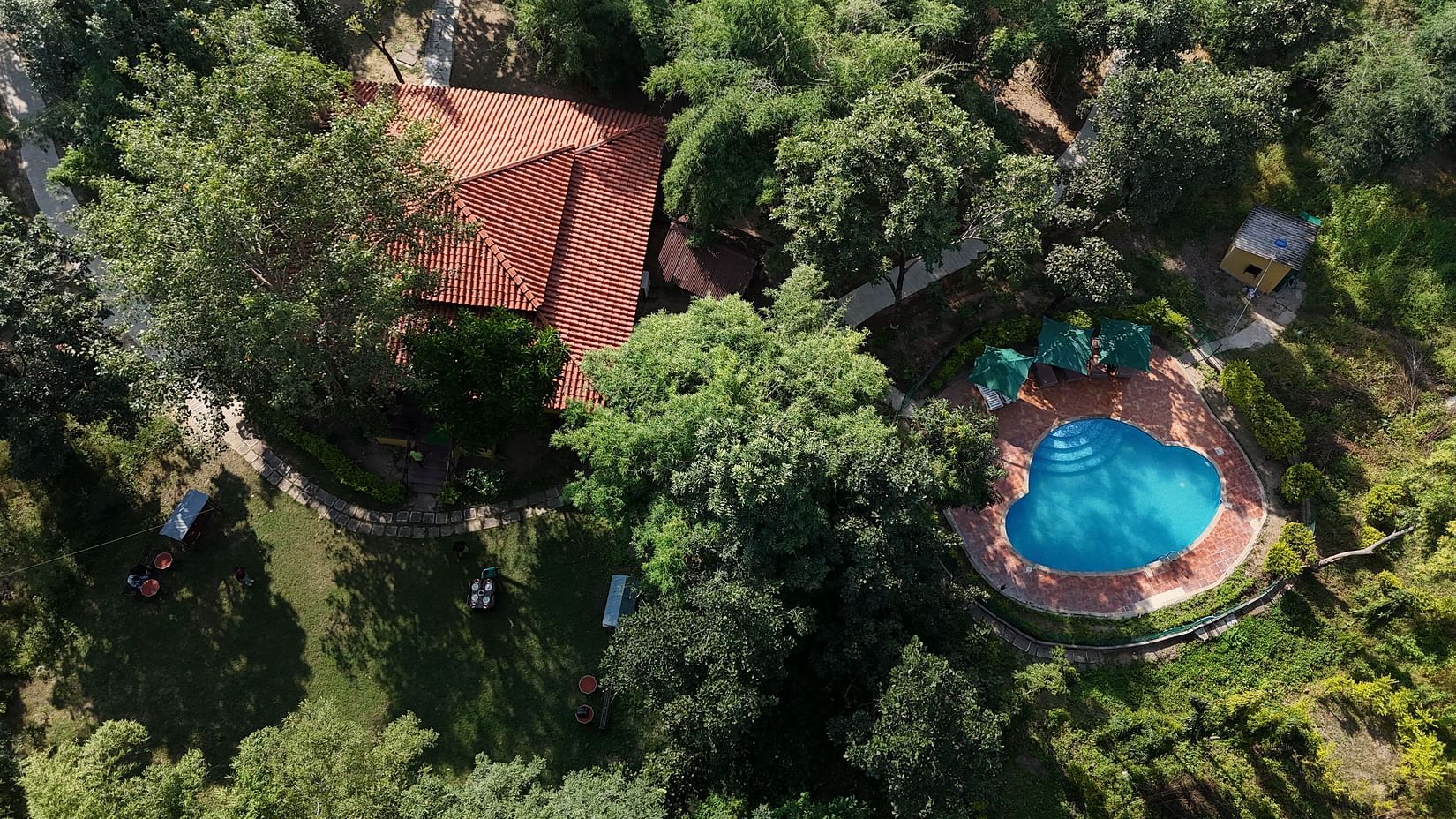 erene property with a pool, seen from above. Ideal for a relaxing getaway.