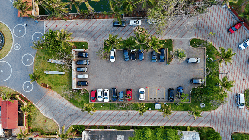A parking space with several cars parked | MGM Beach Resorts