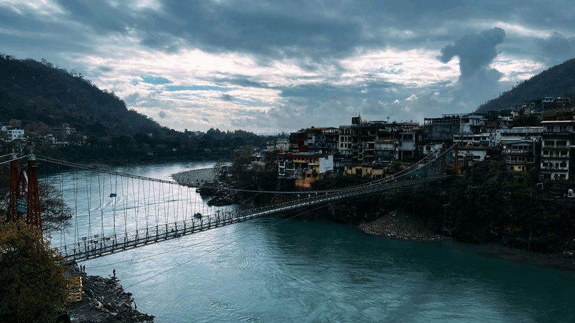 View of Lakshman Jhula bridge in Rishikesh over the ganges near Neemrana The Glasshouse on The Ganges.