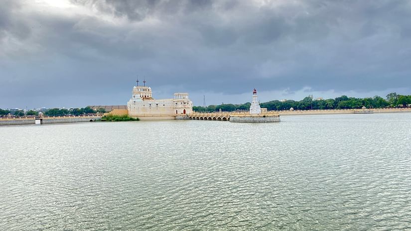 A view of a water palace in Jamnagar with dark clouds in the background