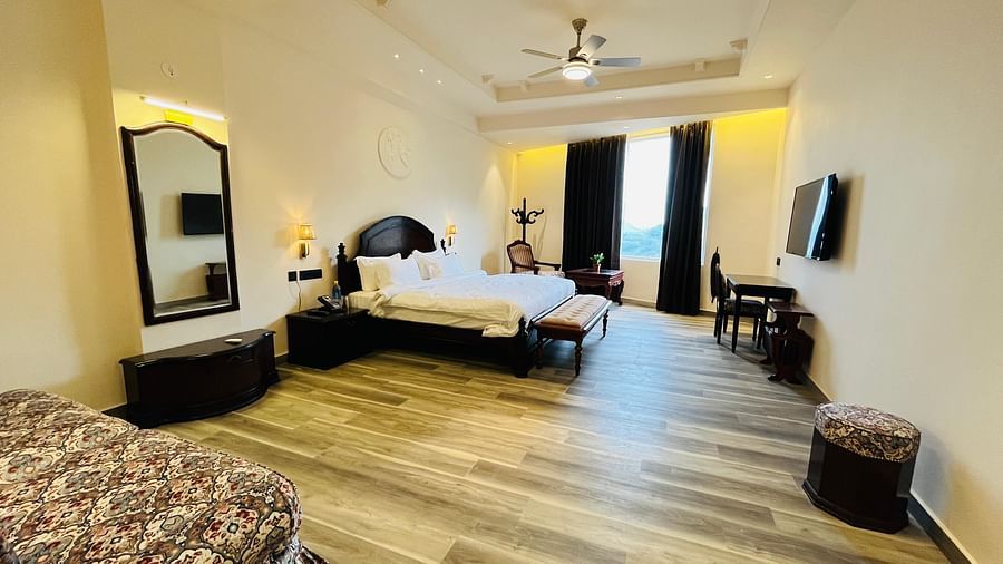 an image of a room with a television and a dressing table Clarks Resort The Archi’s Castle, Ajmer