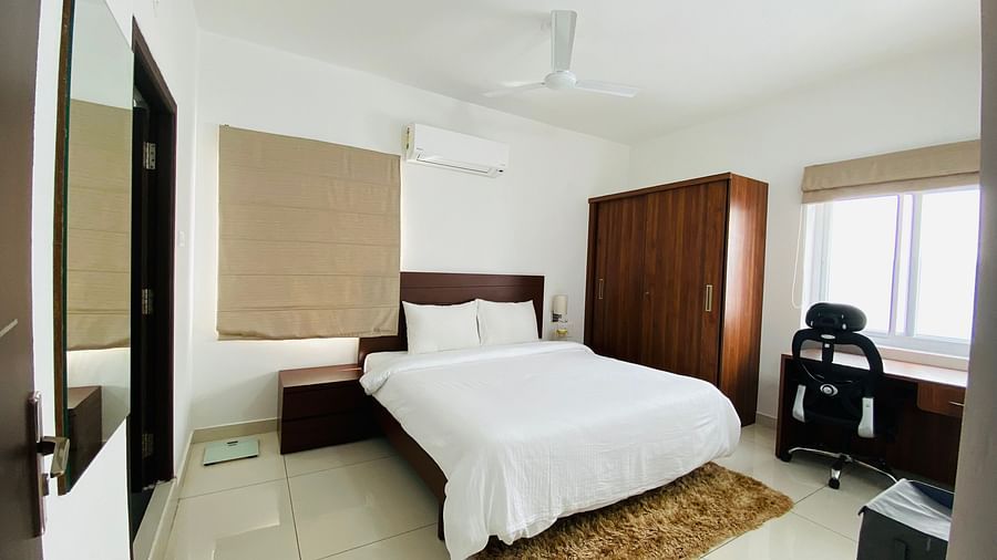2 BHK room at Courtyard By Yuhi Hospitality Services Tirupati with white linens