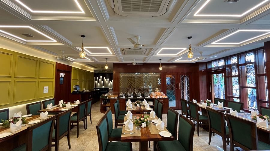 An image of a dining area featuring several sets of chairs and tables which has plates and cutlery places - Five Elements Hotels, Jodhpur