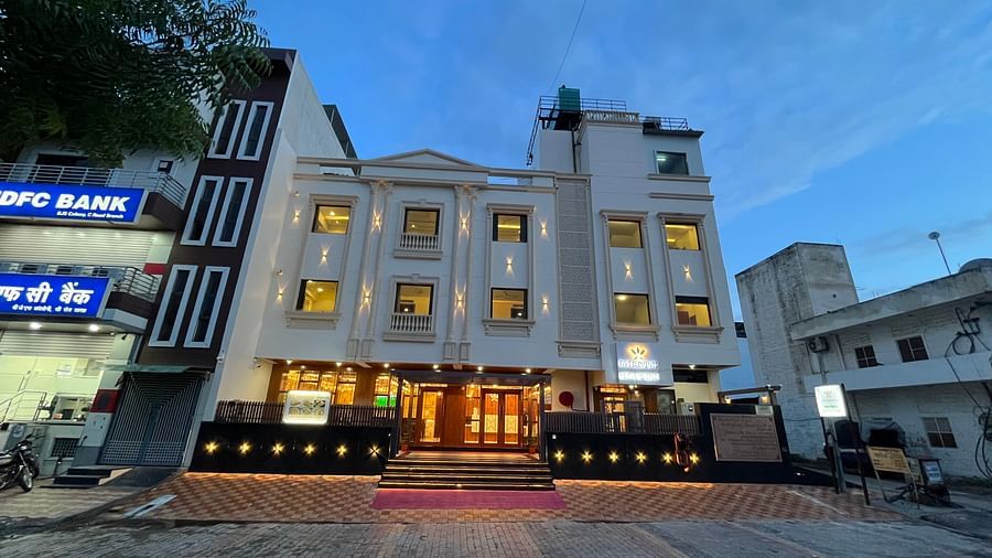 An image of a well lit facade of Five Elements Hotel, Jodhpur which also has buildings on either side