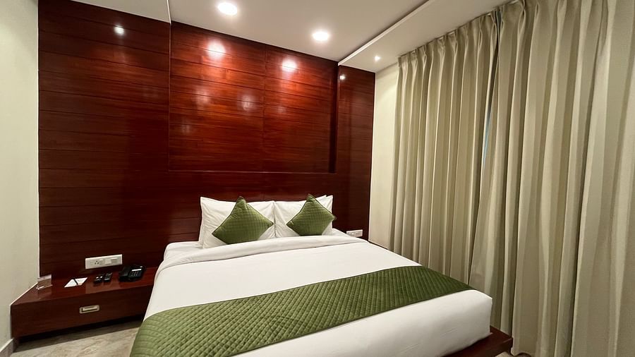 An image of a bedroom featuring a double size bed and a bedside table next to it at Five Elements Hotel, Jodhpur