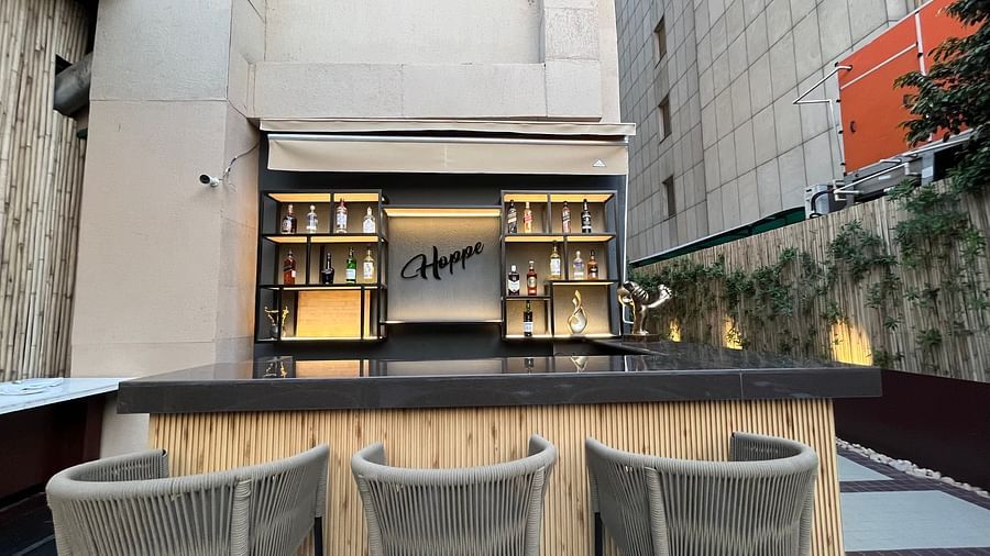 Nemesia has a bar area with an awning and seating along the counter.