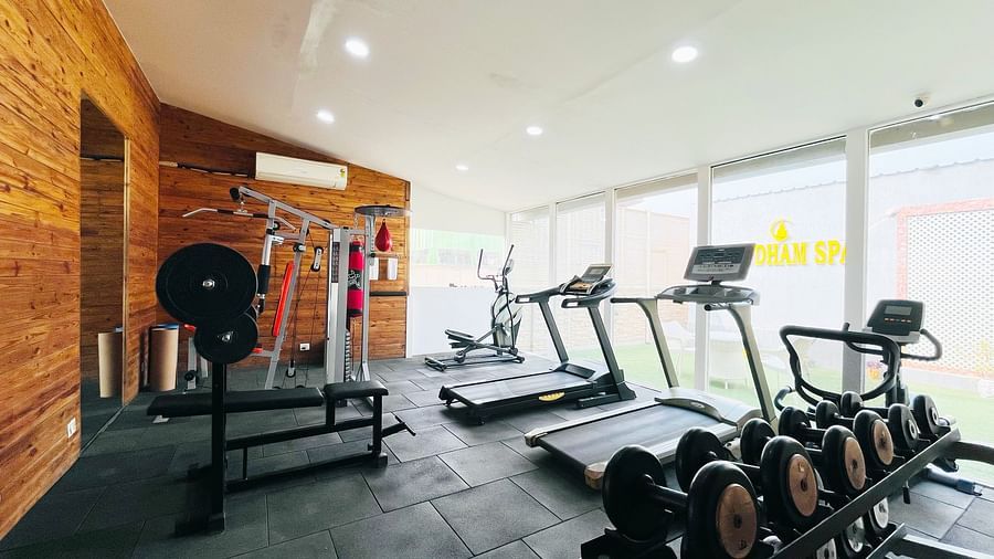 Fitness center at Nemesia with a variety of cardio and strength training equipment, including treadmills, weight machines, and free weights.