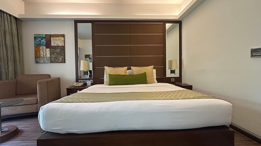 closer view of a bedroom king size bed with white linens - yuhi mansions2