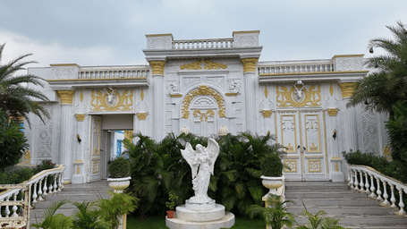 A statue with trees infront of it