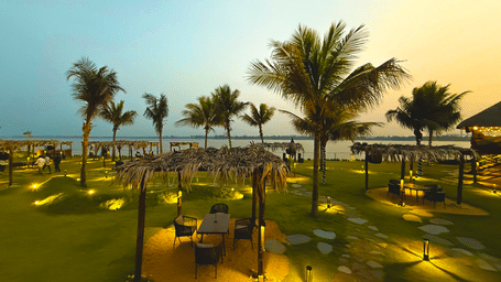 Elevated view of the lawn of Hotel Sonar Bangla, Kolaghat, seen with trees and place lightings.