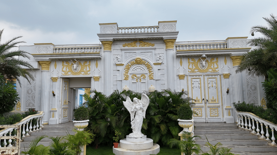A statue with trees infront of it
