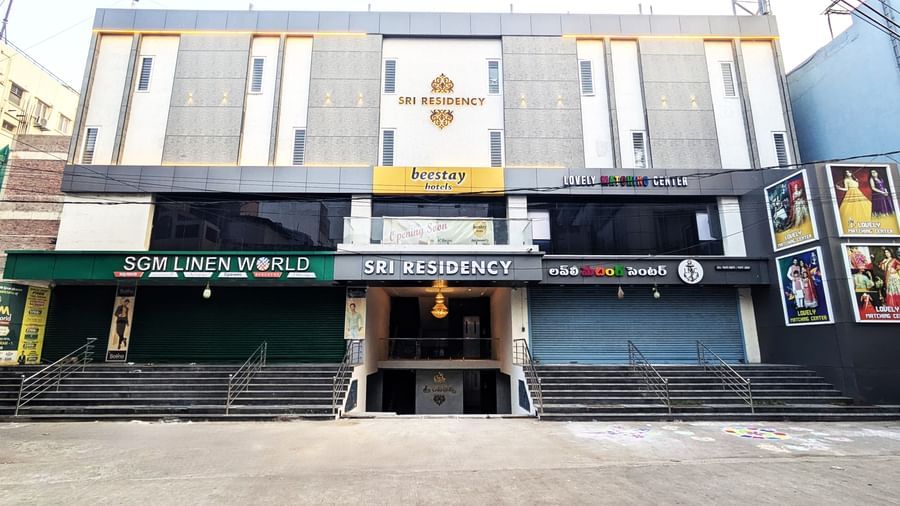 Street view of Beestay Hotels showing entrance and neighbouring shops at Beestay Hotels, Rajahmundry.
