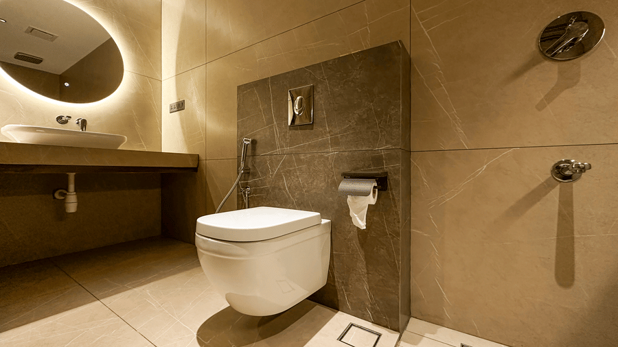 The commode in the bathroom of the Deluxe Room, beside the wash basin at F Hotels, Bengaluru.