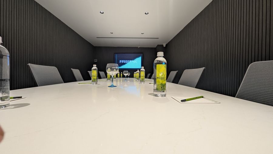 Meeting room setup with bottled water at Fressotel, Kanakapura Road, Bangalore.