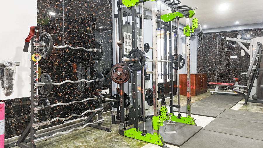 Close-up view of a green and black multi-functional cable machine in a gym - Luffu Club