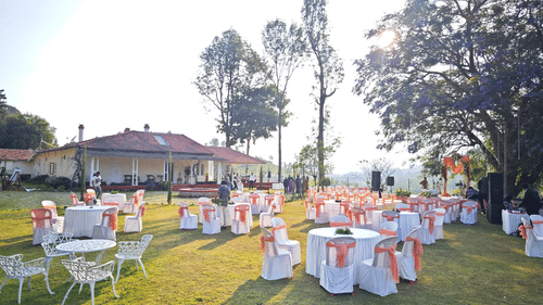 View of an outdoor wedding venue set against a backdrop of lush greenery and hills in Coonoor - Ibex Resort, Coonoor (Leewood).