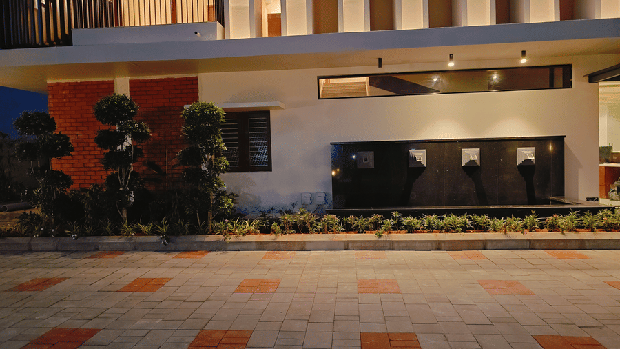 The daytime exterior of Bliss Giriya By Bergamont Tiruvannamalai with a paved forecourt and landscaped surroundings.