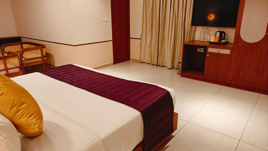 A neatly presented standard room at Bliss Giriya By Bergamont Tiruvannamalai with a double bed and compact furnishings.