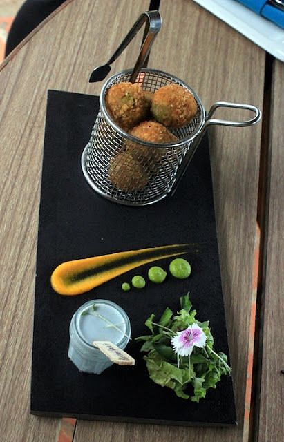 An image of a fried delicacy beautifully served on a platter