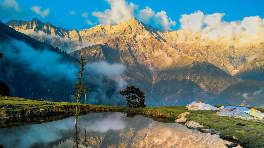 white mountains and clouds surrounding clear blue water body @ Lamrin Norwood Green, Palampur