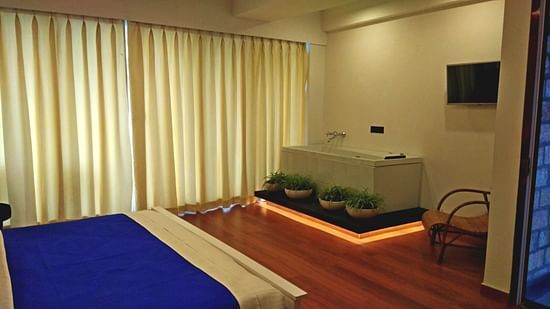 a bed with blue pillows and duvets 1