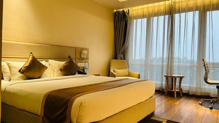 a view of a king bed of Executive King bed room at Wonder country club resort