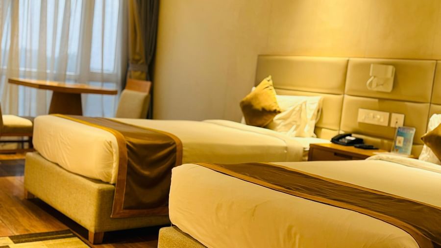 a view of the twin bed and a work desk at Executive Twin bed room at Wonder country club resort