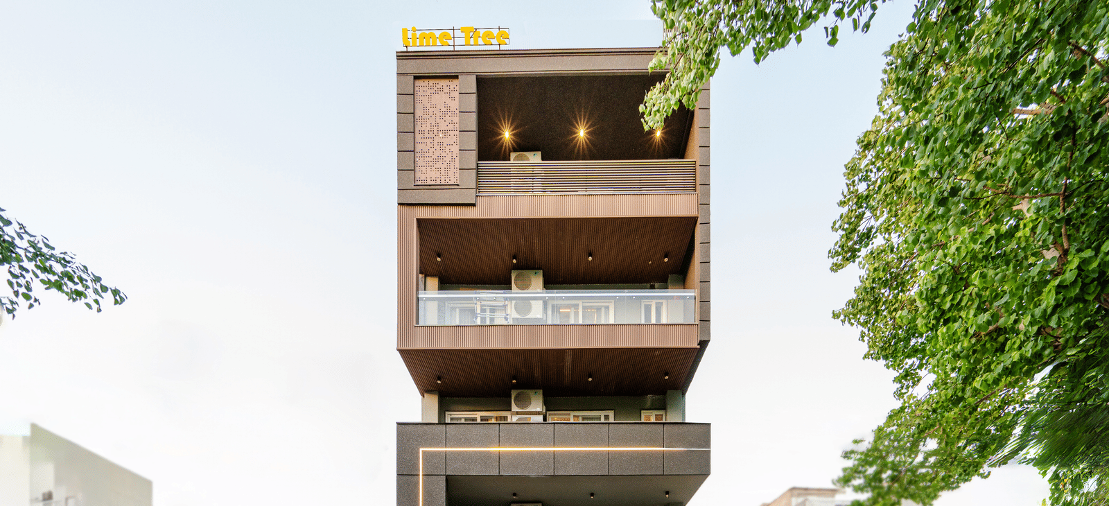 Exterior view of a multi-storey serviced apartment building with balconies at Lime Tree 1BHK Service Apartment Near Artemis Hospital Gurgaon.