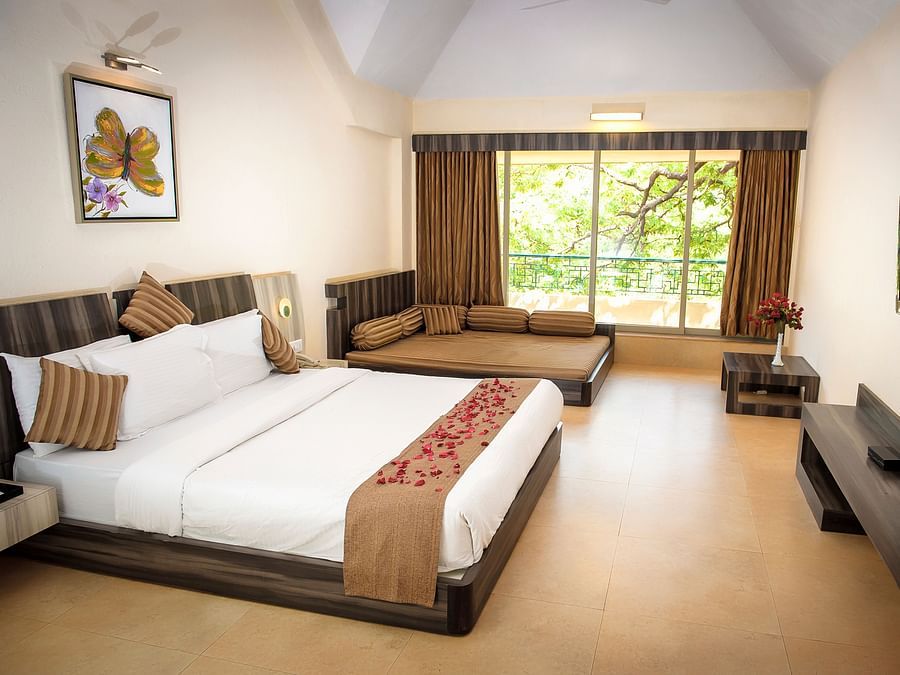 Adamo Resort Matheran - A close up view of the bed in Regency Room