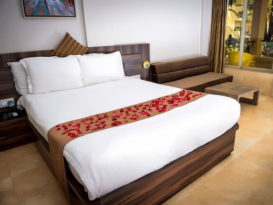 Adamo Resort Matheran - A close up view of the bed in Regent Room