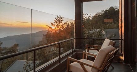 A balcony with two chairs which provides a sunset view | Kavya Resort and Spa, Nagarkot