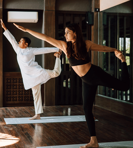 Two people practicing yoga in a morning light | Kavya Resort and Spa, Nagarkot