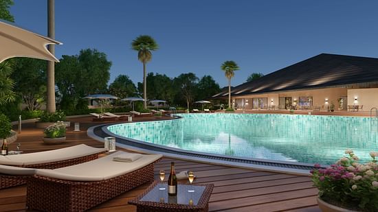 a large swimming pool with loungers next to it in the Club House - Ananta Spa and Resort, Ajabgarh
